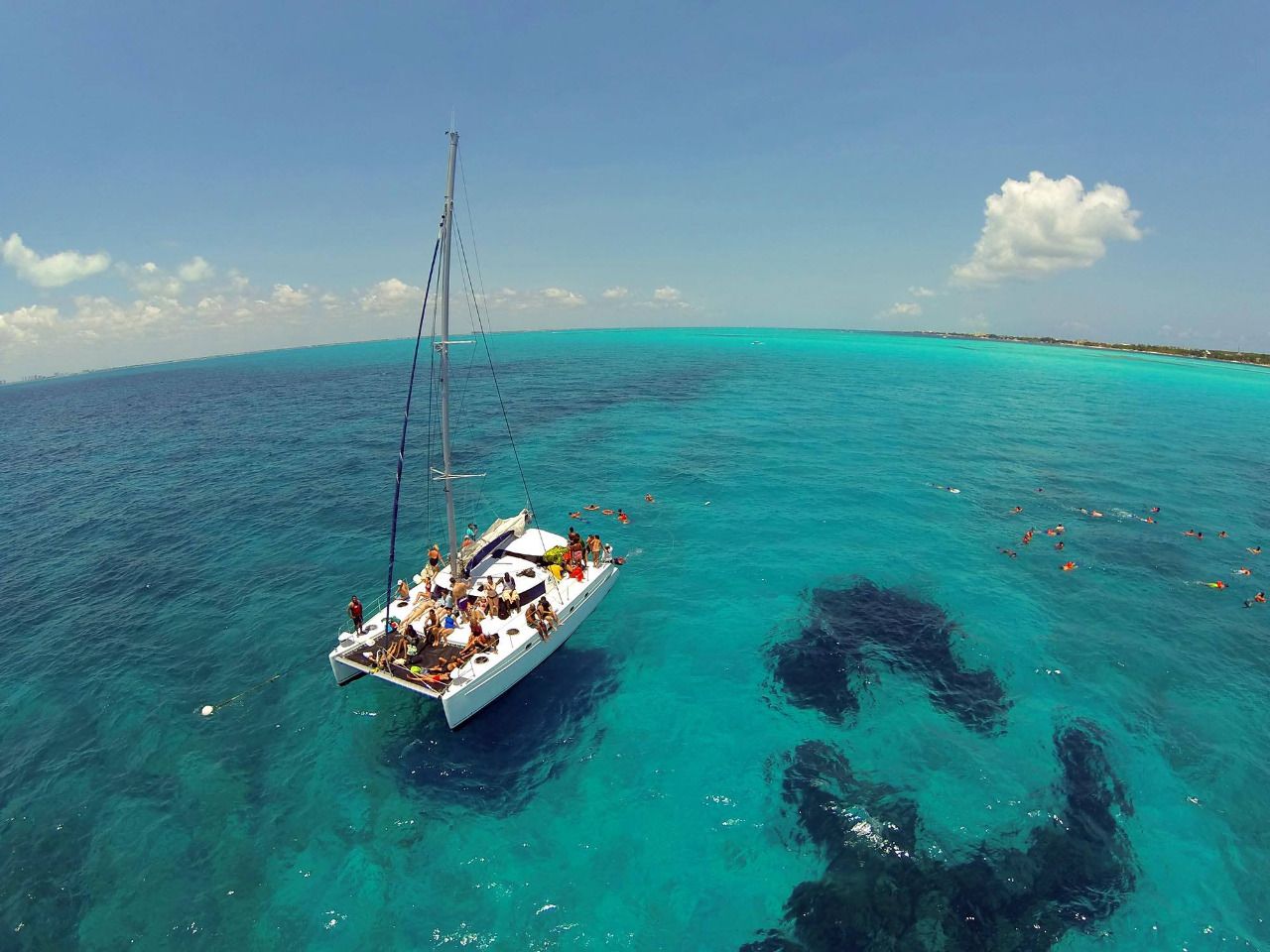 Guests enjoying open bar on the catamaran